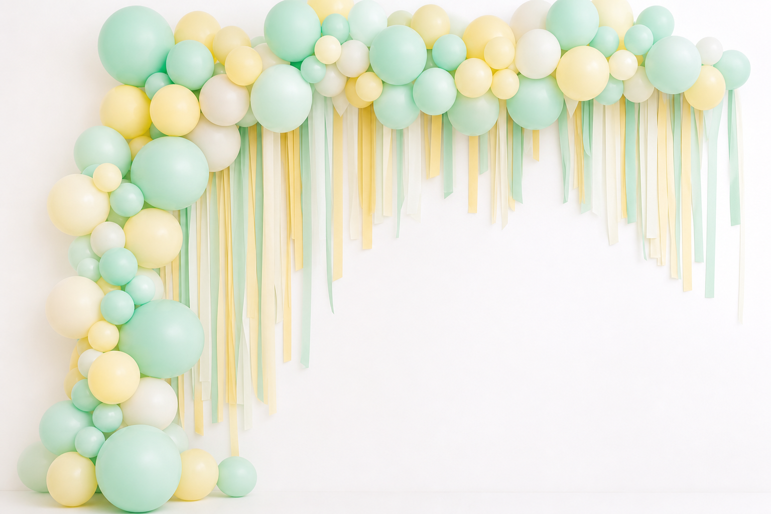 Pastel balloon garland and streamer installation